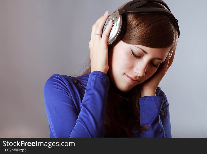 Beautiful Headphones Girl on blue background