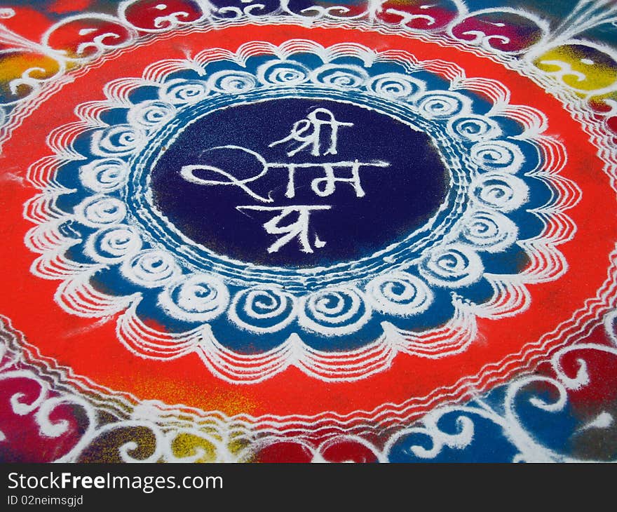 A beautiful street painting with colored powder done as a traditional Indian art.