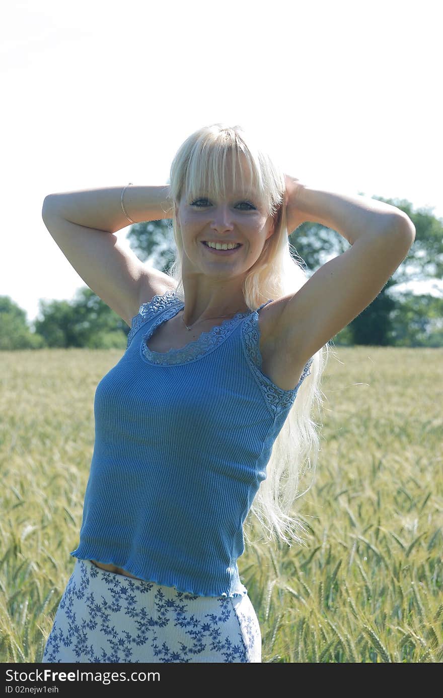 Blond woman in field