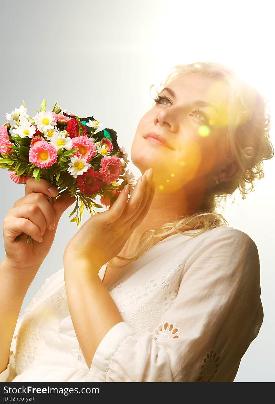 Lovely woman with a butterfly over blue sky