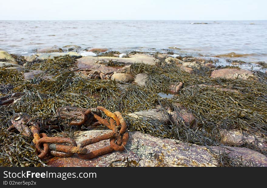 Rusty chain on the White Sea coast. . Rusty chain on the White Sea coast.