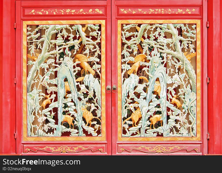 Full frame Chinese style wooden red door as cage, Ayutthaya Thailand.