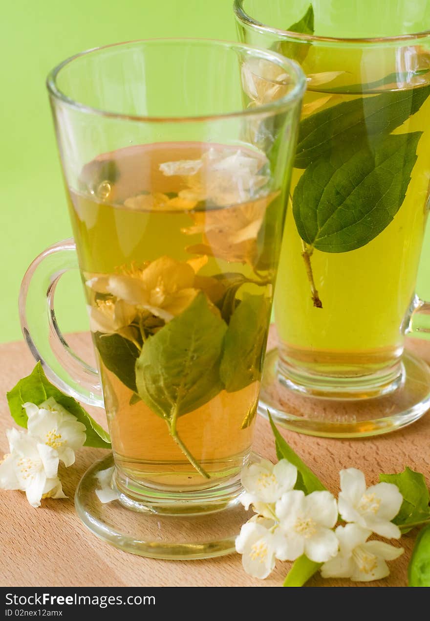 Organic jasmine tea with fresh jasmine flowers. Organic jasmine tea with fresh jasmine flowers.