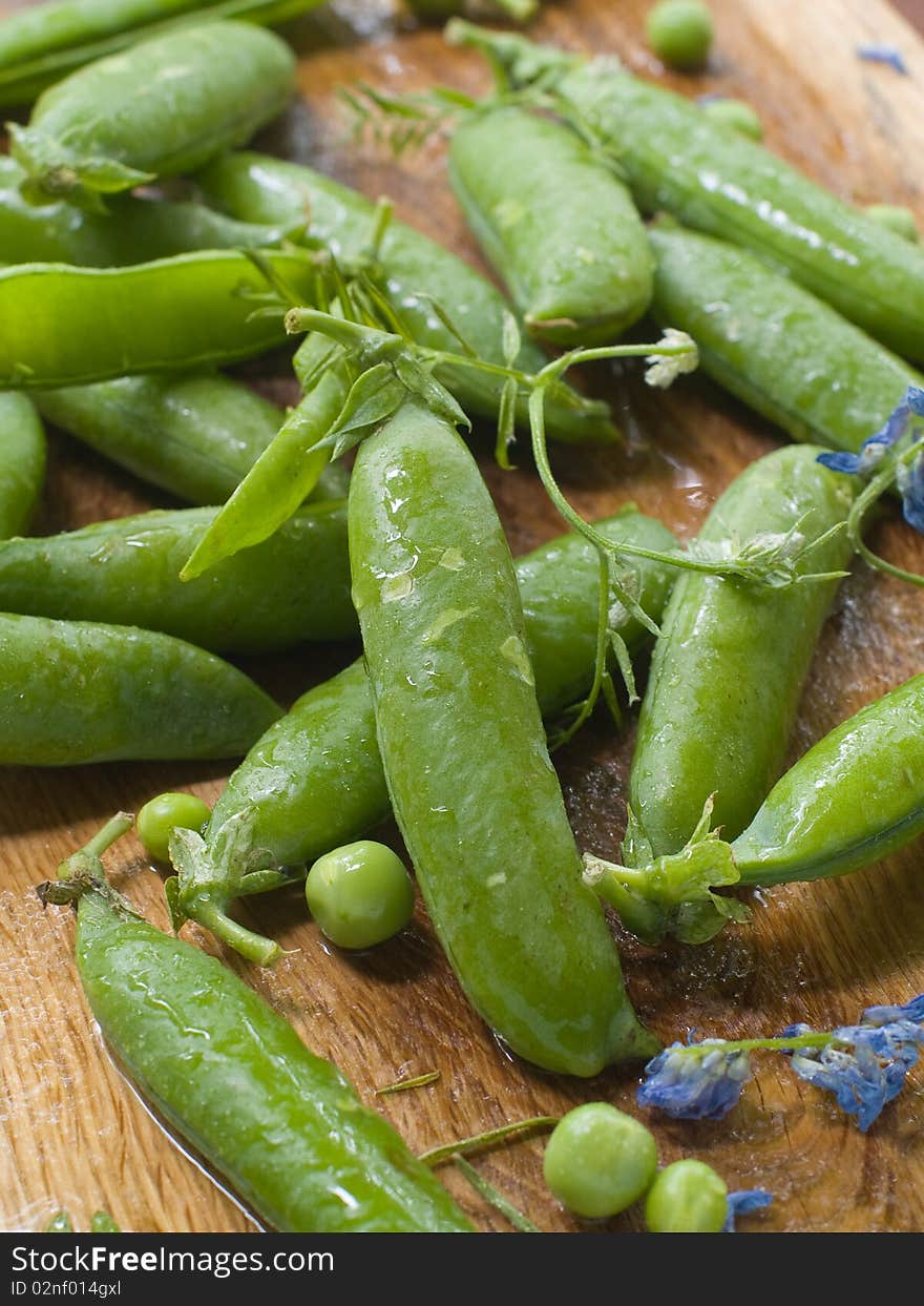 Fresh garden peas pods and flowers. Fresh garden peas pods and flowers