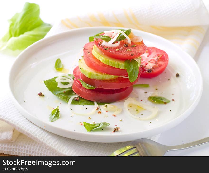 Snack from tomatoes and zuccini with olive oil. Snack from tomatoes and zuccini with olive oil