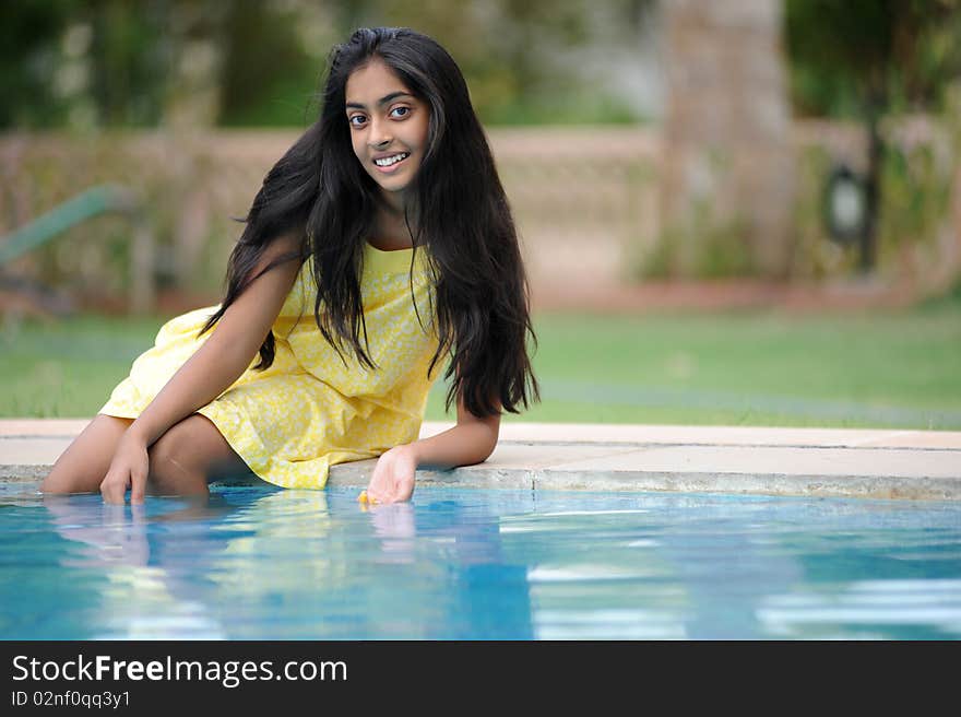 Girl Sitting At Pool