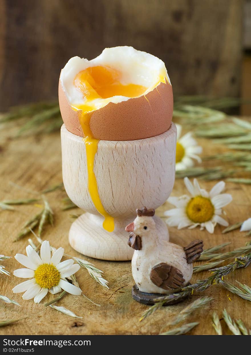 Soft boiled egg in wooden eggcup