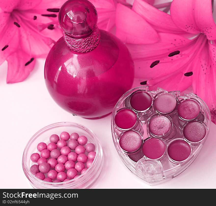 Bottle of perfume and flowers