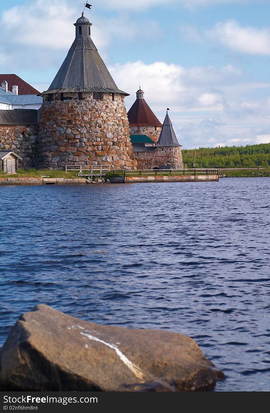 Old round stone tower in Solovetsky monastery with blue sky background, Karelia, Russian Federation. Old round stone tower in Solovetsky monastery with blue sky background, Karelia, Russian Federation.