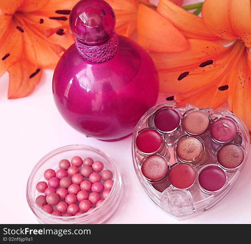 Perfume and makeup with flower. Perfume and makeup with flower