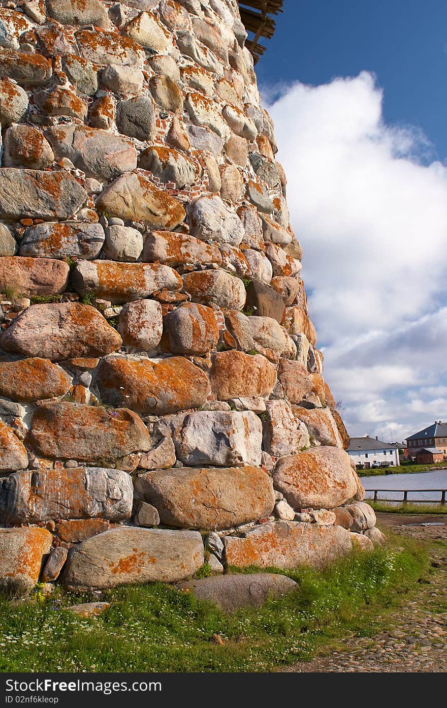 Old round stone tower in Solovetsky monastery with blue sky background, Karelia, Russian Federation. Old round stone tower in Solovetsky monastery with blue sky background, Karelia, Russian Federation.