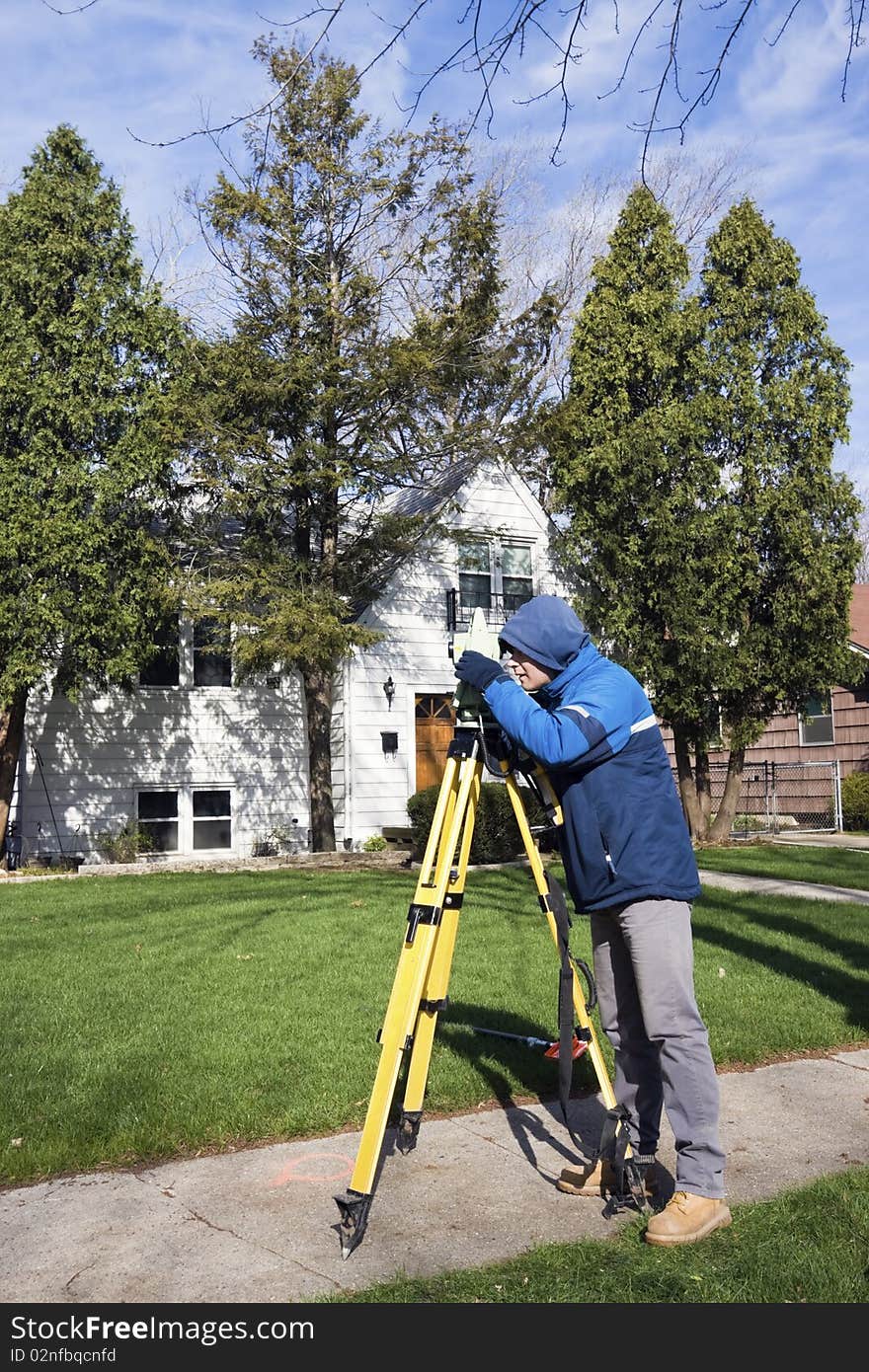 Surveyor working with theodolite