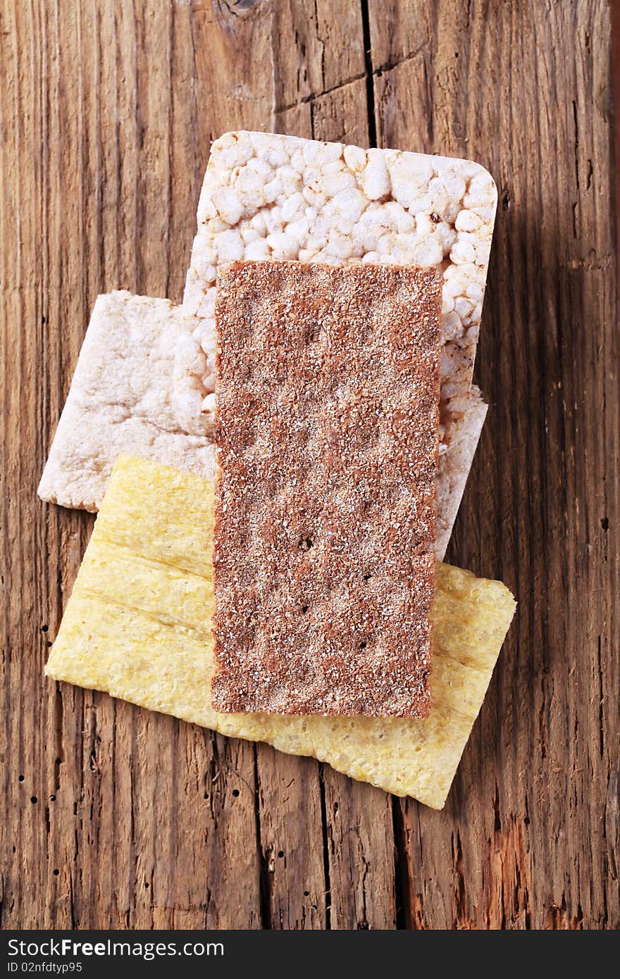 Variety of crispbread on wood - overhead