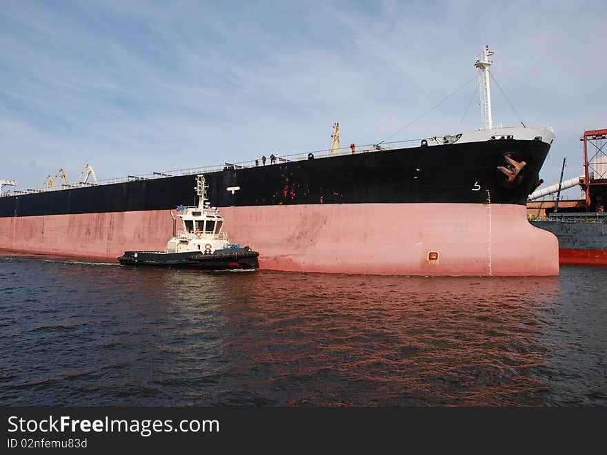 Container ship coming into port Ventspils, Latvia