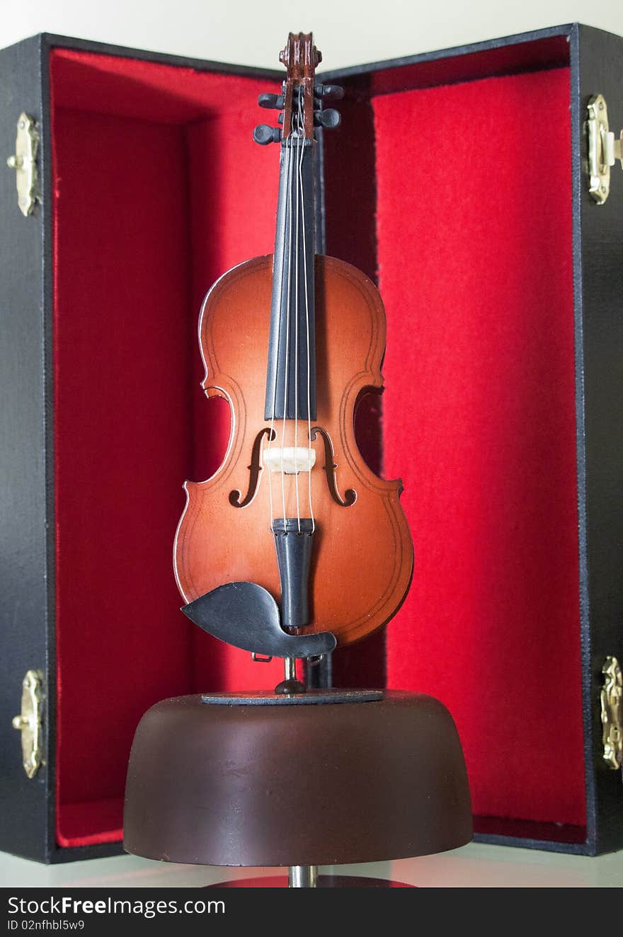 Violin on stand with red velvet case (replica)