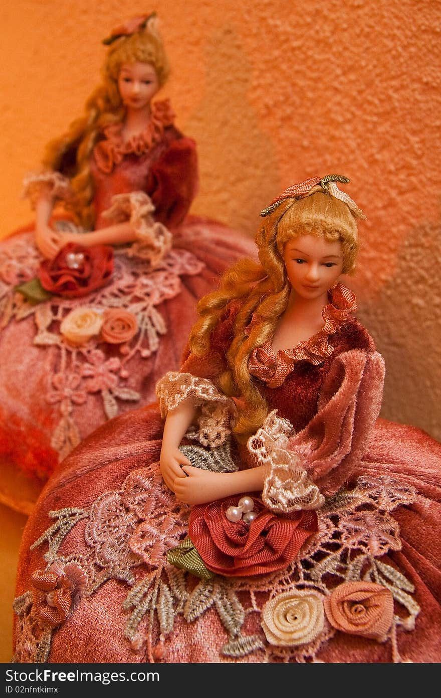 Couple dolls seated on the table. Couple dolls seated on the table