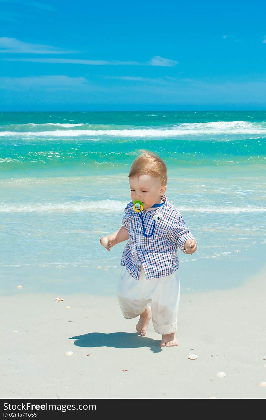 Child walking on a beach. Child walking on a beach