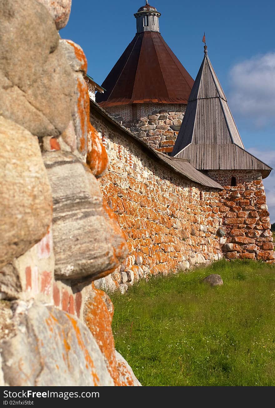 Old round stone tower in Solovetsky monastery with blue sky background, Karelia, Russian Federation. Old round stone tower in Solovetsky monastery with blue sky background, Karelia, Russian Federation.