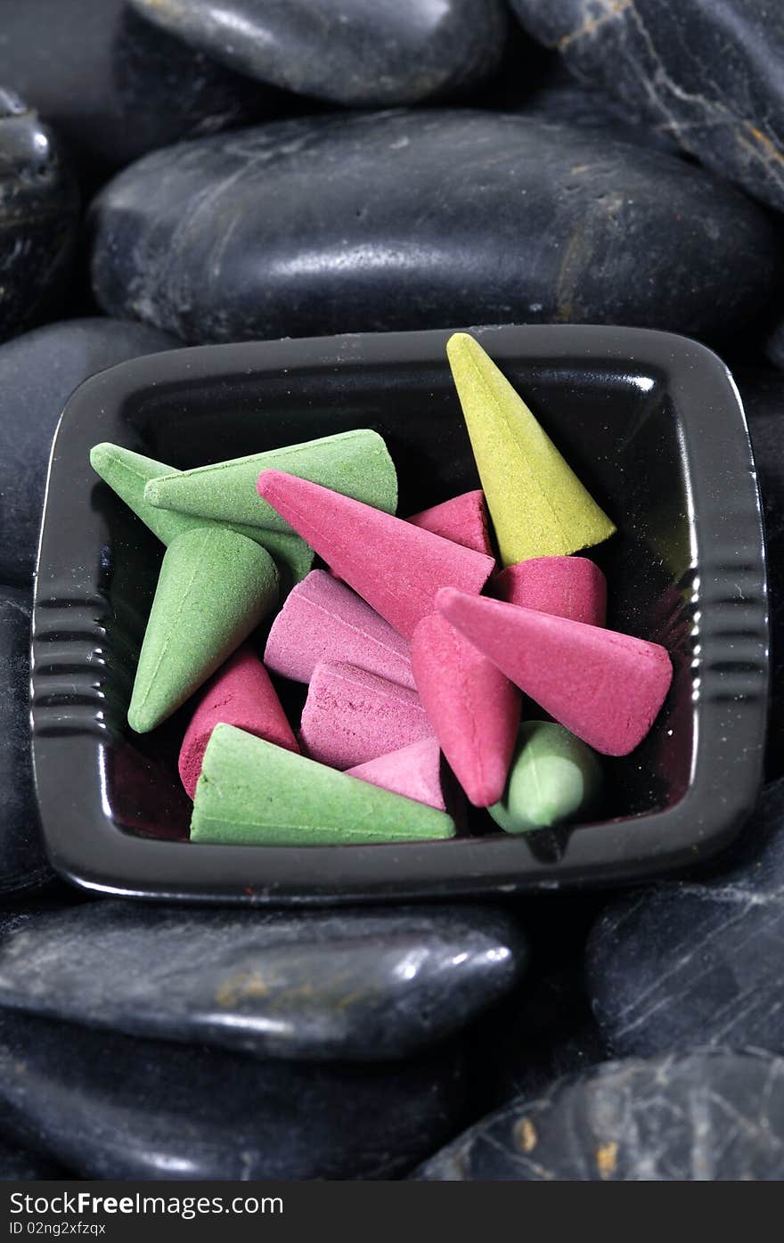 Bowl of spa scented on pebbles