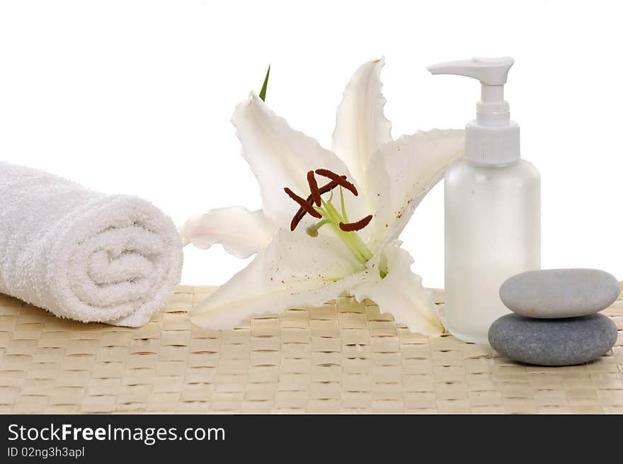 Madonna lily flower and spa stones with bottles. Madonna lily flower and spa stones with bottles