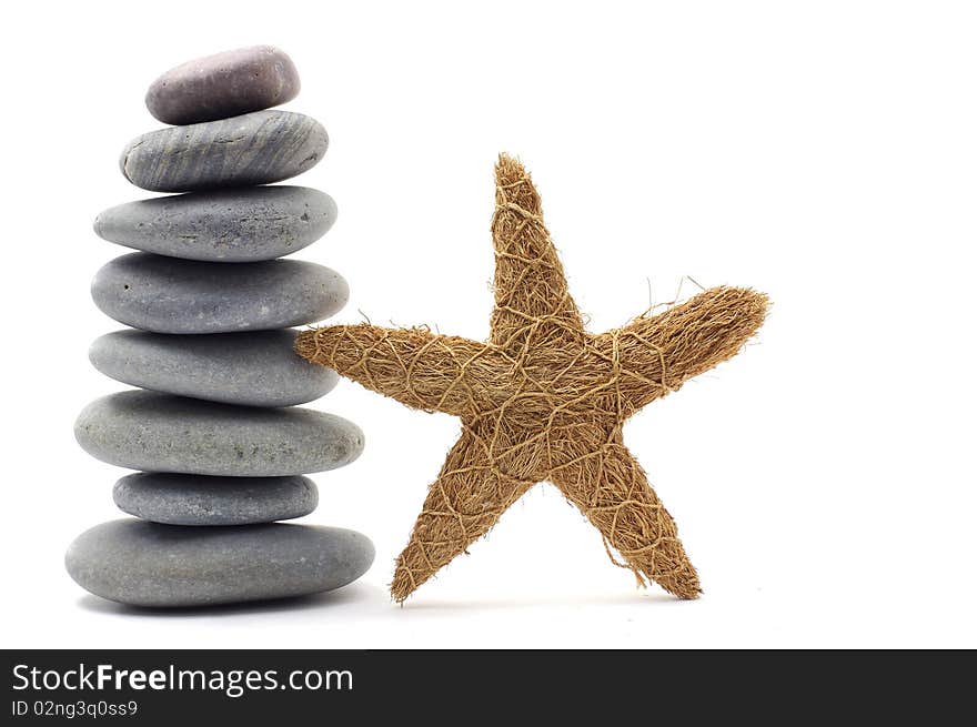 Stack stones with starfish on white. Stack stones with starfish on white