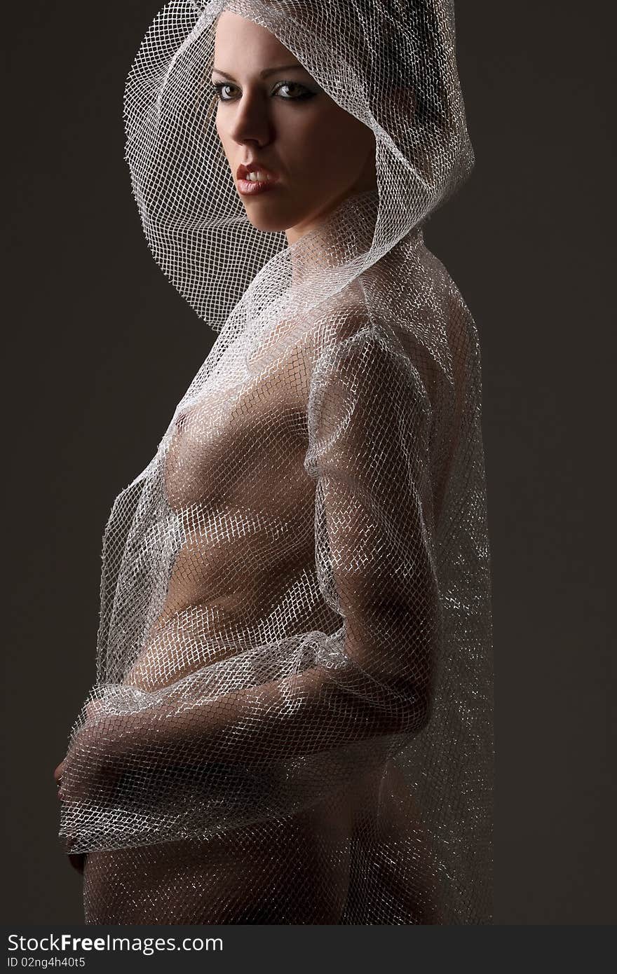 Dancer wearing mesh cloak