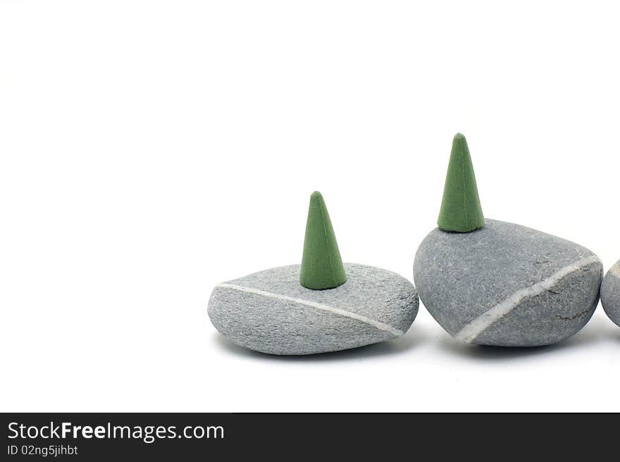 Green Incense cones on gray stones. Green Incense cones on gray stones