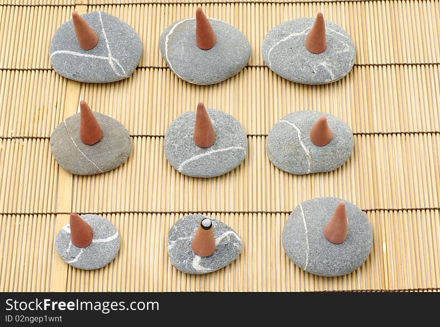 Top view of row incense cones and stone. Top view of row incense cones and stone