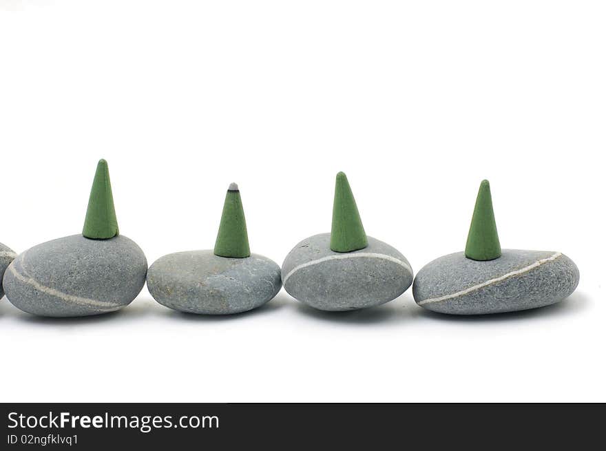 Incense cones and stone  on white. Incense cones and stone  on white