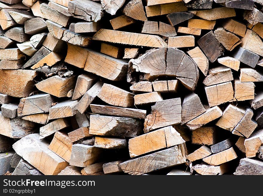 Heap of firewoods as background . Close - up . Heap of firewoods as background . Close - up .