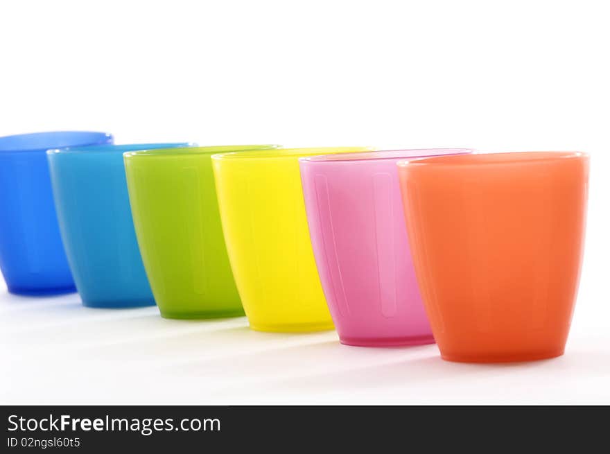 Row of Various coloured cups. Row of Various coloured cups