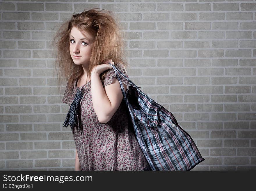 Tired Redhaired Woman With Shopping Bag.