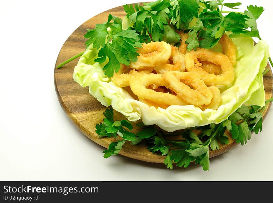 Fried squid rings with green. Fried squid rings with green