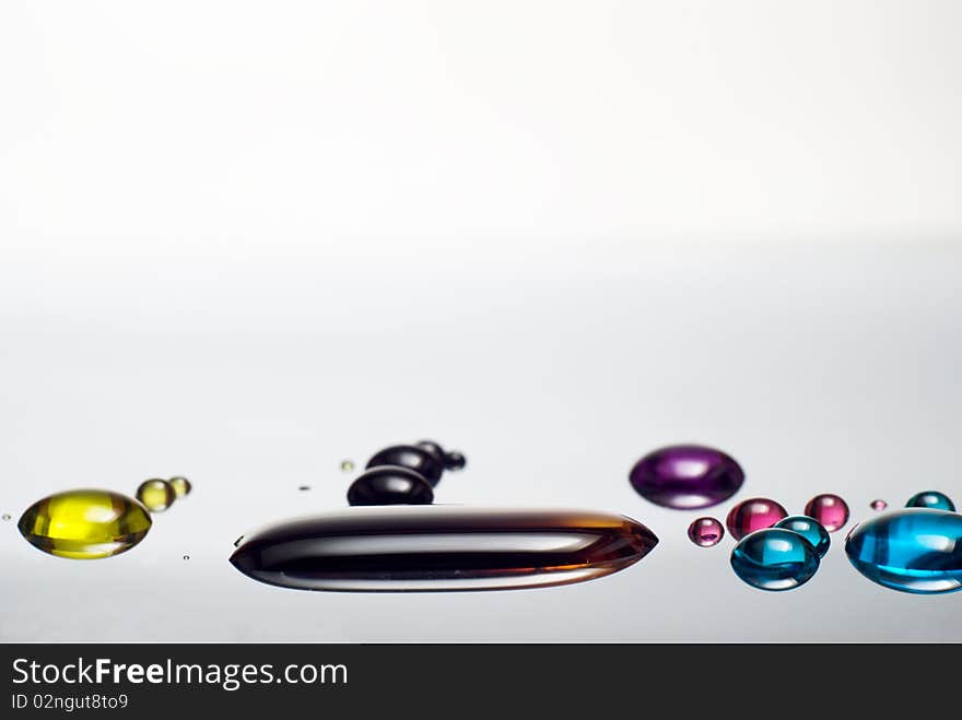 Colorful liquid drops on metal surface