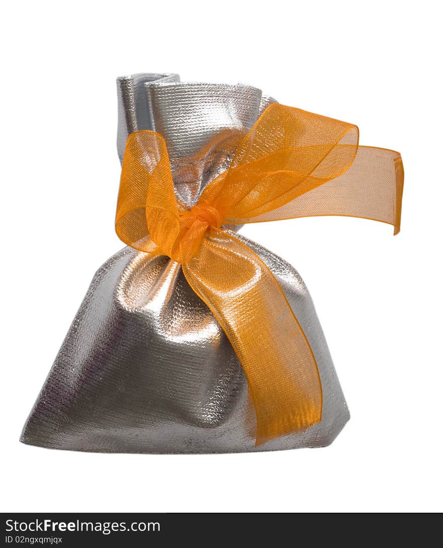 In the silver bag with orange bow. In the silver bag with orange bow