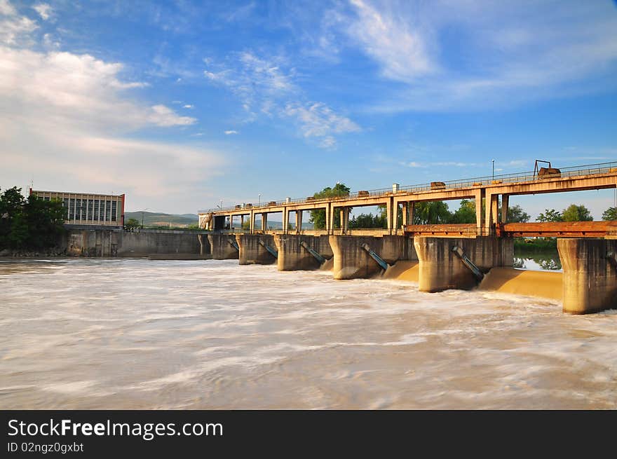 A dam water with light blue sky. A dam water with light blue sky