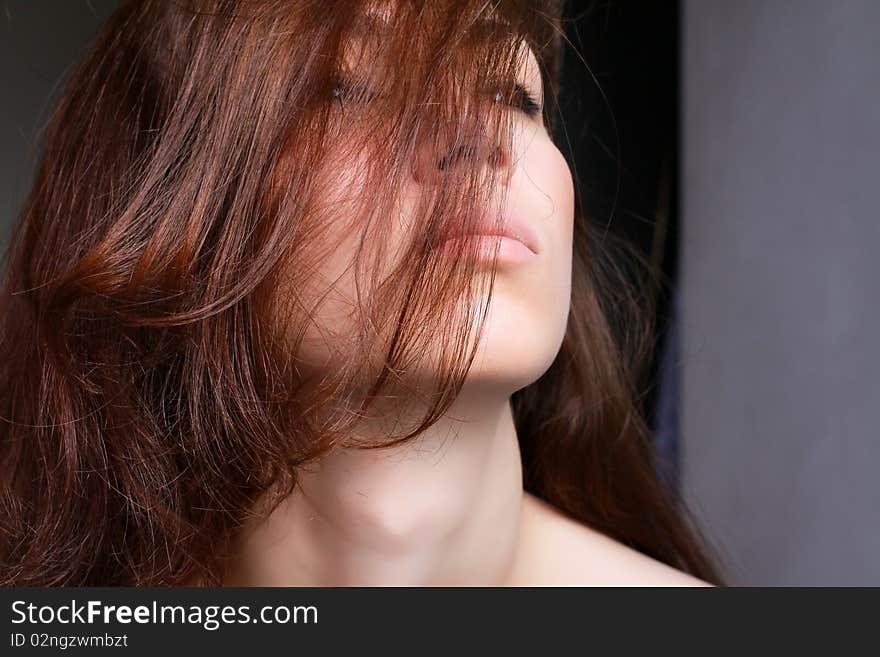 Closeup of a brunette girl face side view profile. Closeup of a brunette girl face side view profile