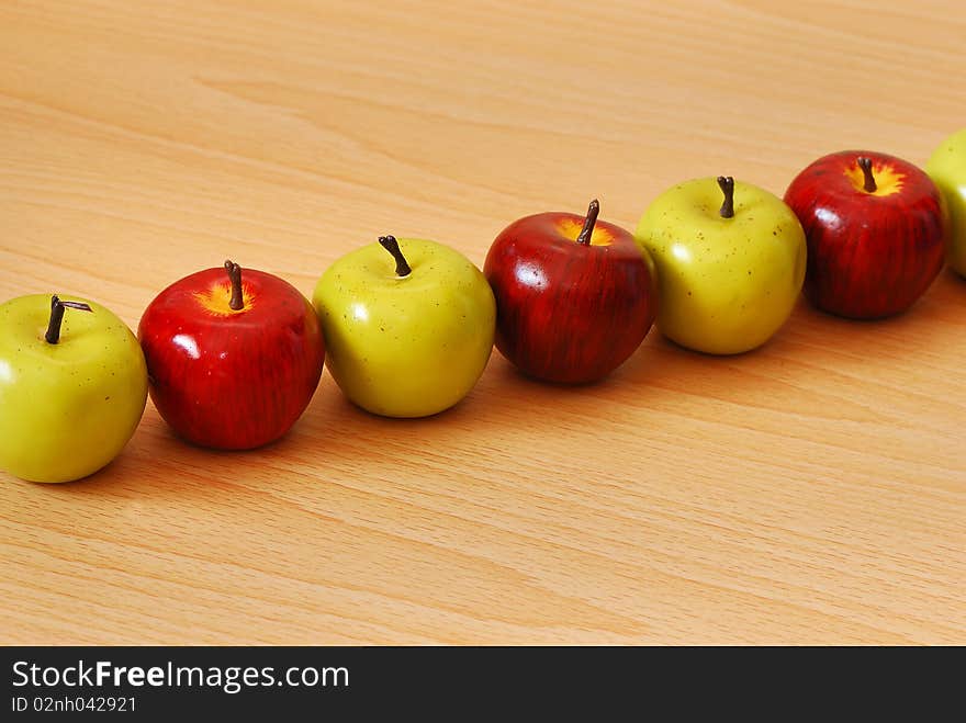 A row of green and red apples