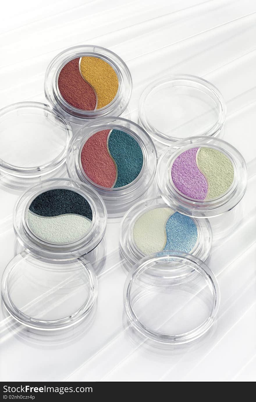 Five eye shadows on a luminous background