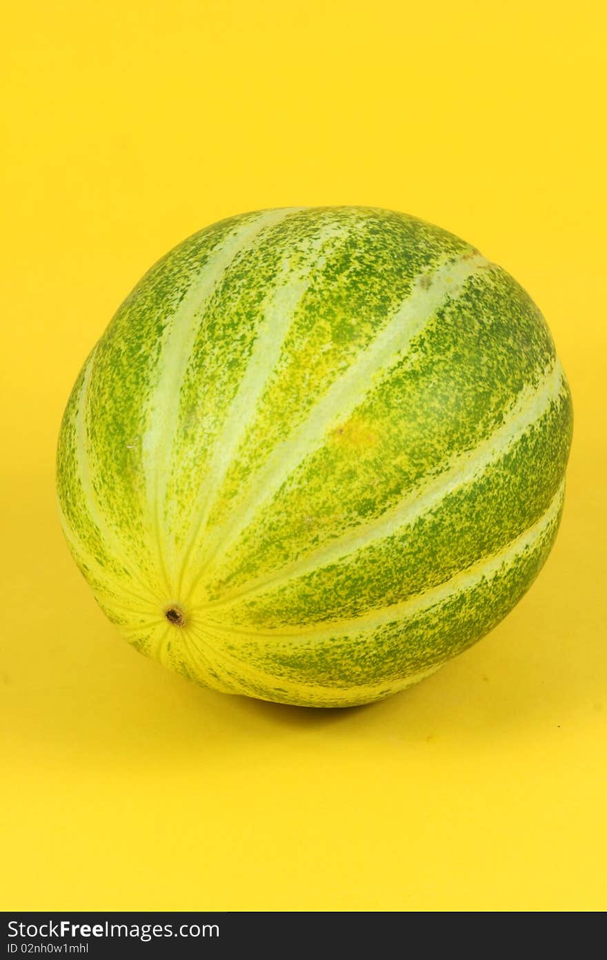 Single Muskmelon on yellow background