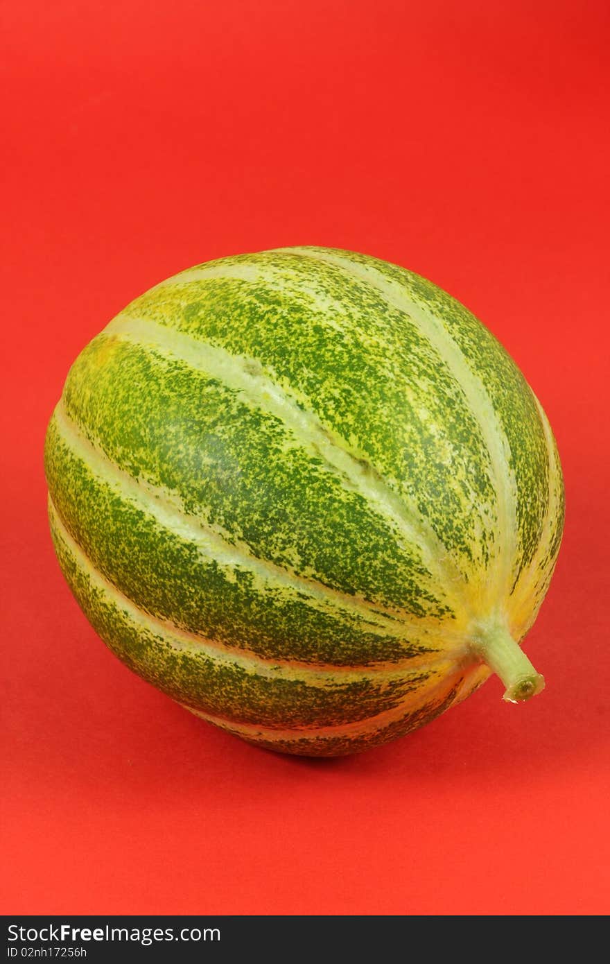 Single Muskmelon  on red background