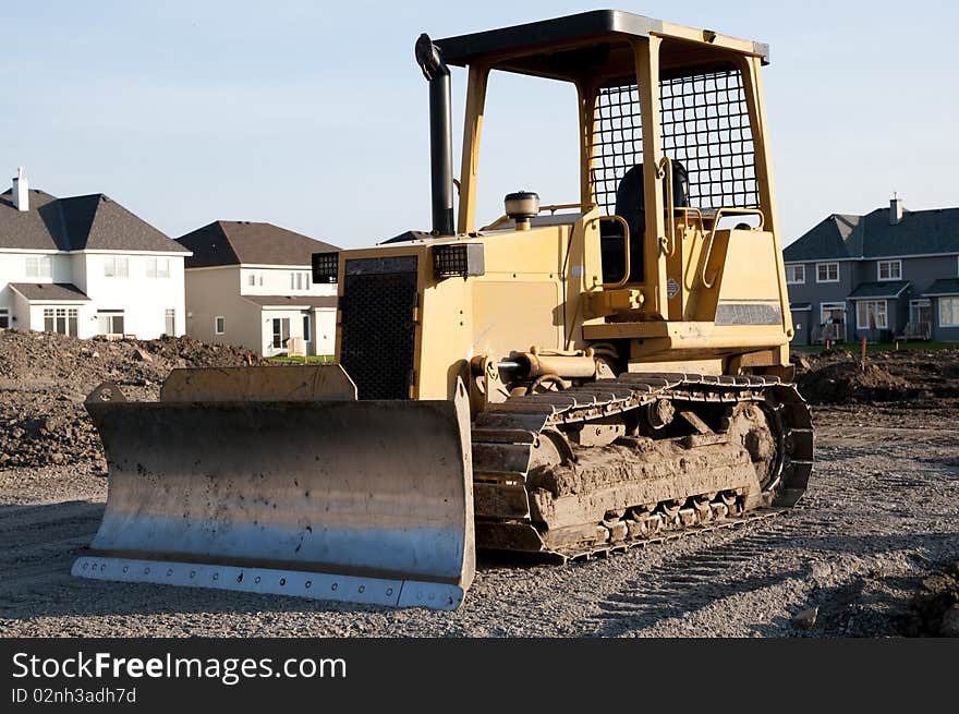 Bulldozer on new home construction site. Bulldozer on new home construction site