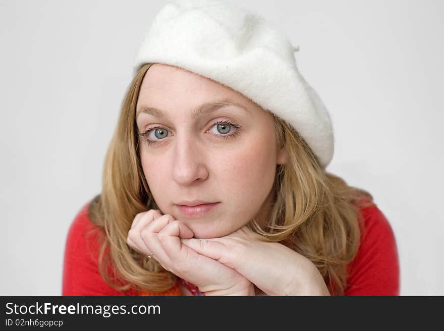 Young woman in white beret