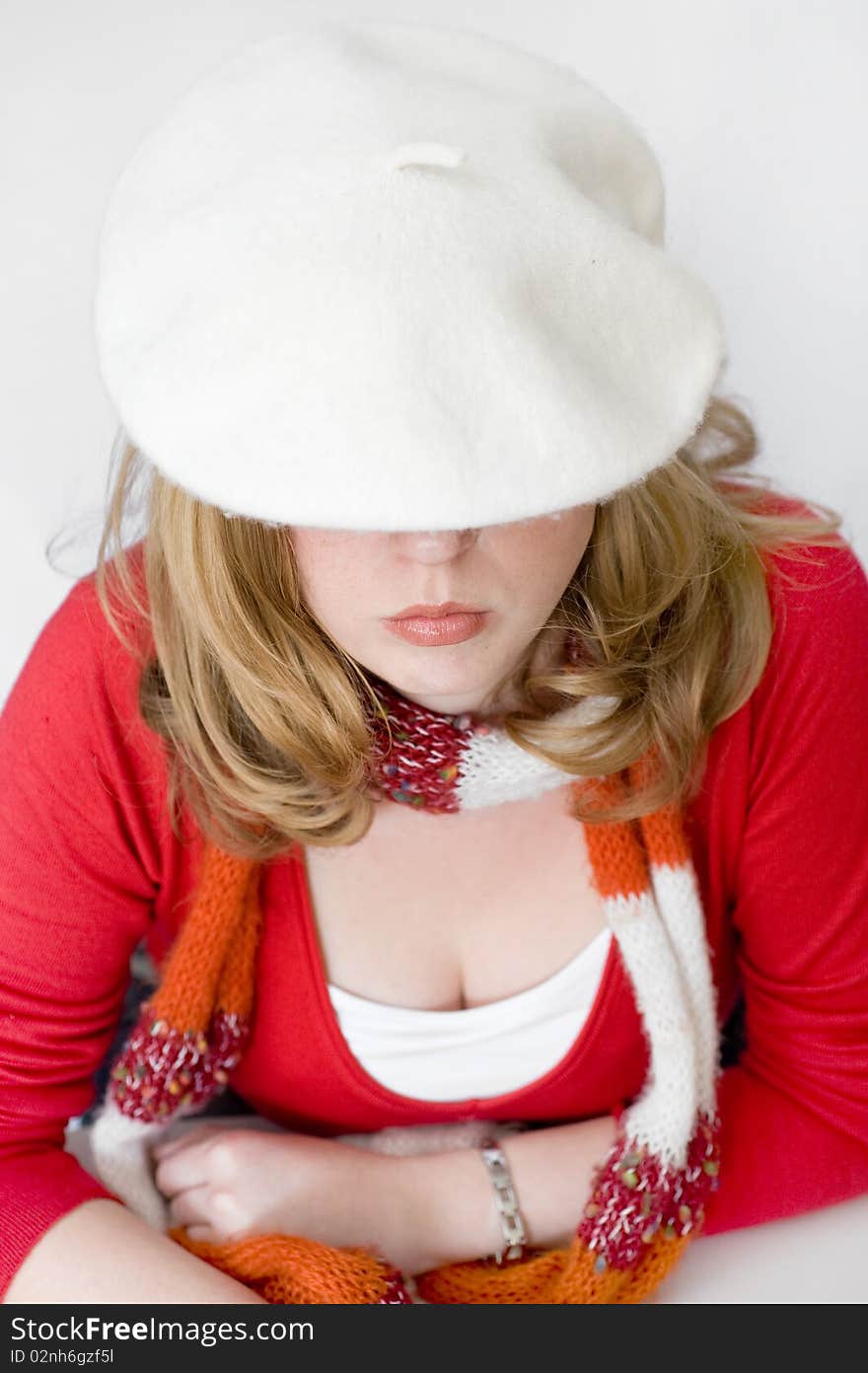 Young woman in white beret and scarf