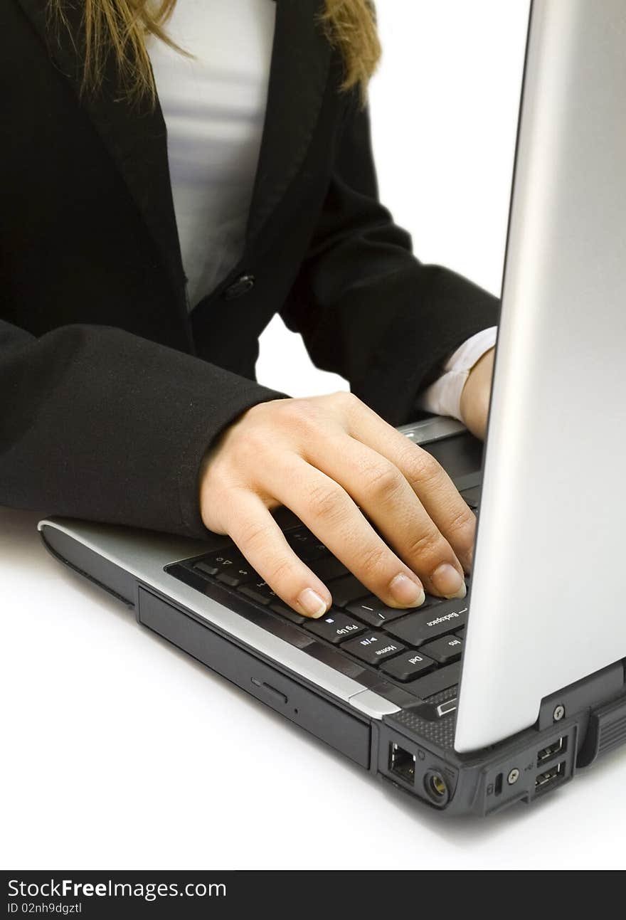 Two female hands on the laptop isolated on white background