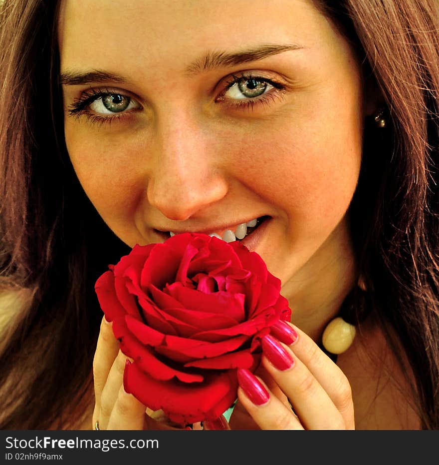 Charming young woman enjoy aroma beautiful red rose. Charming young woman enjoy aroma beautiful red rose