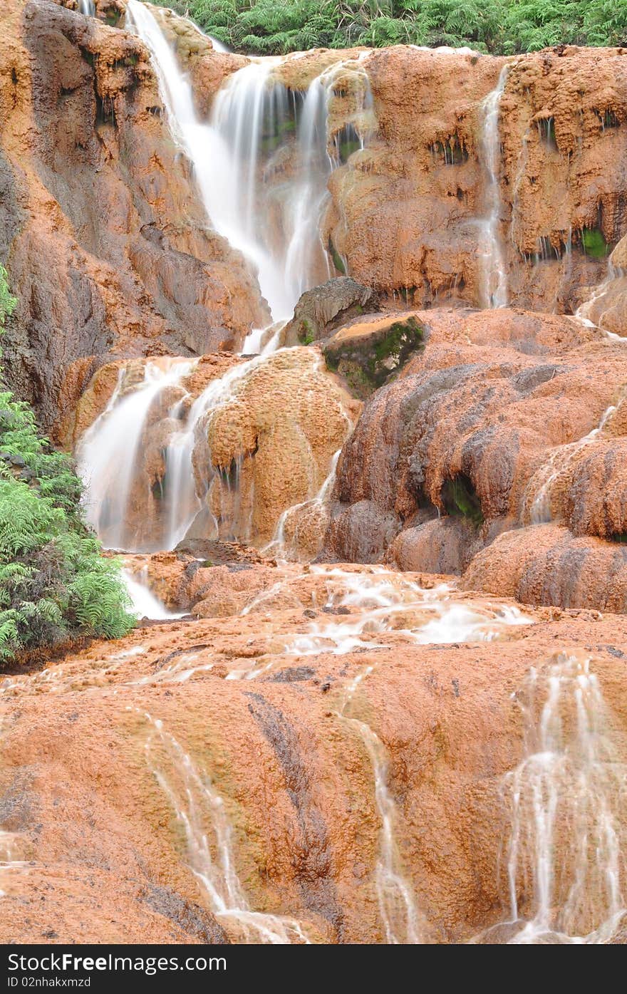 Waterfall with red soils called gold-fall