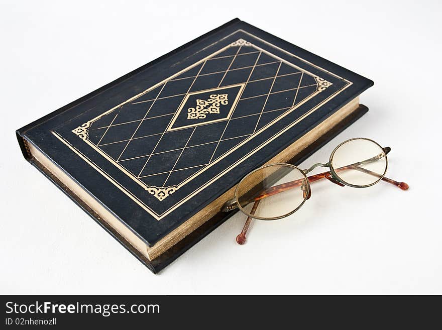 Old book with eye glass. Old book with eye glass