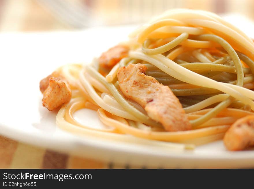 Spaguetti on a plate on white