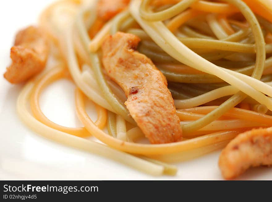 Spaguetti on a plate on white